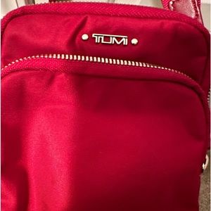 Red Tumi crossbody bag